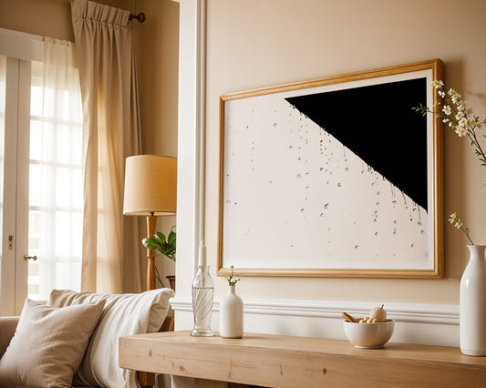 A modern living room with beige walls, a tan sofa, and a wooden table with vases, features minimalist design touches and the FN Prints "Abstract Water Droplets" wall art—a contemporary masterpiece lit by natural light.