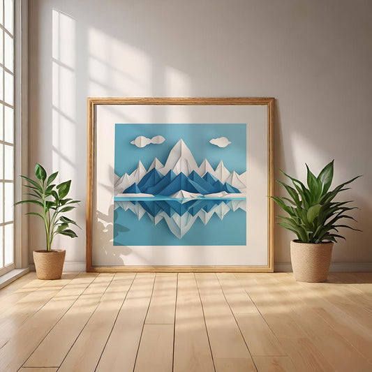 An artwork titled "Arctic Landscape IV" by FN Prints, featuring a folded paper effect of an Arctic mountain scene, is set on a wooden floor. The frame is flanked by two potted plants, while sunlight pours through the large windows, creating shadows across the space.