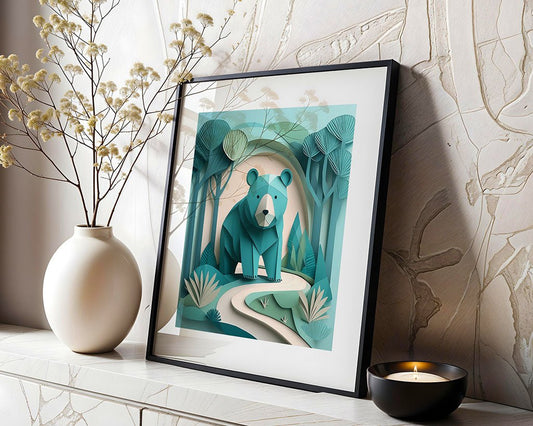 A framed paper-cut art piece by FN Prints, titled "Bao The Bear," showcases a teal-colored bear in a forest setting and sits on a shelf. Next to it, there is a white vase with dried flowers and a lit candle in a small holder. This enchanting piece perfectly complements the textured wall art in the background.