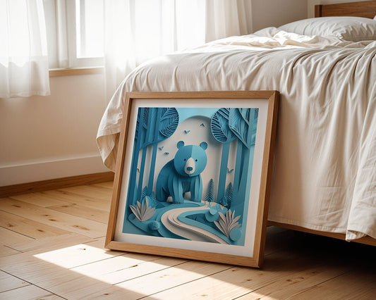 A framed FN Prints artwork titled "Blu The Bear" showcases a children's piece depicting a bear in a stylized blue forest setting, elegantly displayed against a bed in a sunlit bedroom with wooden flooring.