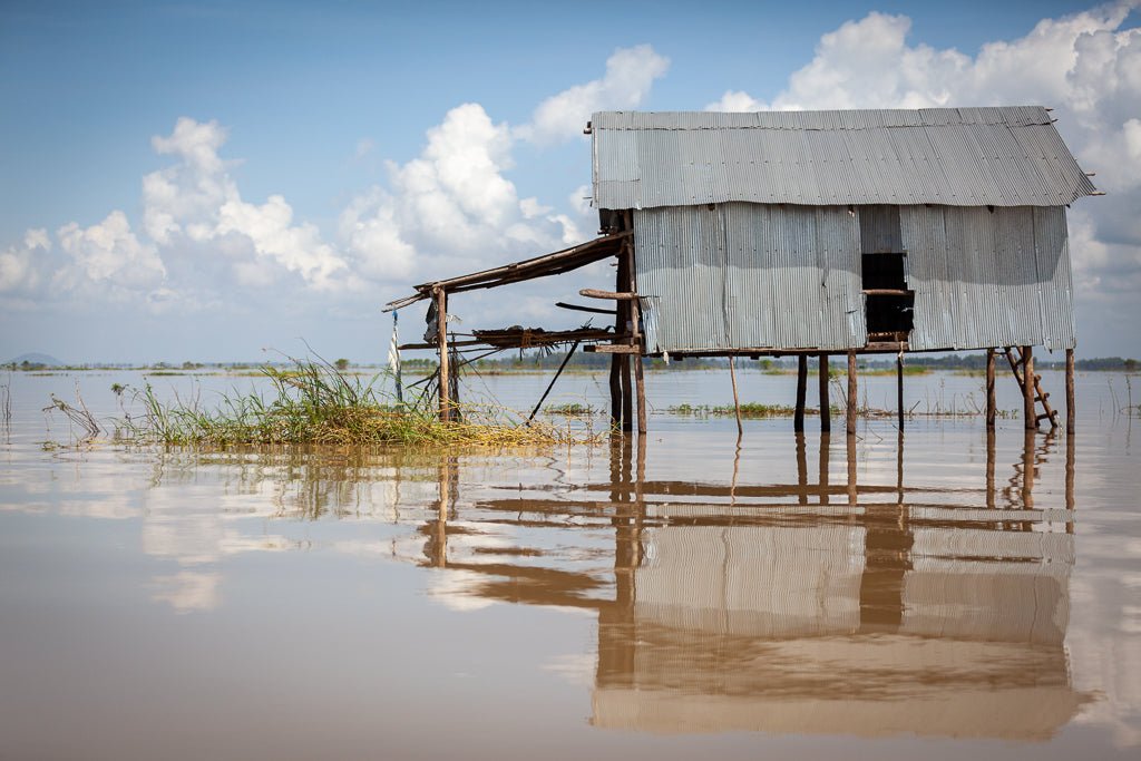 Cambodia a house on stilts on the water.