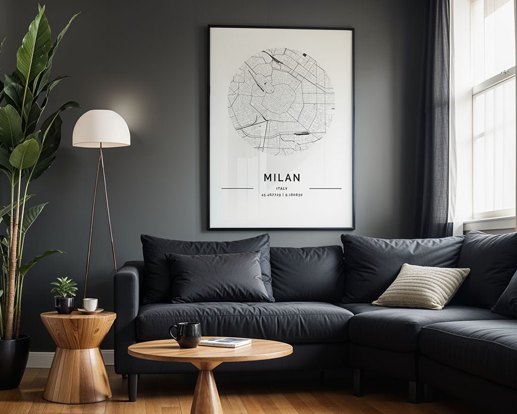 A modern living room with dark gray walls showcases a black sofa, a wooden coffee table, and a floor lamp. A FN Prints Milan City Map poster on premium-quality paper hangs elegantly on the wall. A potted plant stands in the corner as light streams through white-curtained windows.