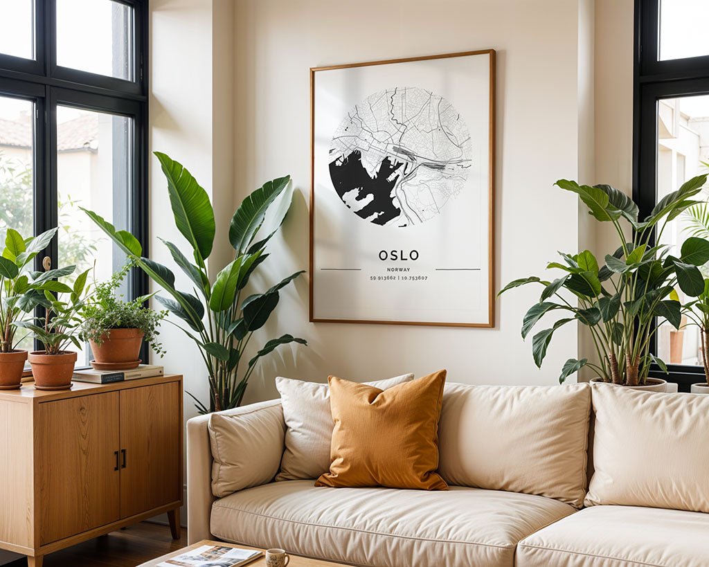 A cozy living room features a beige sofa with a brown cushion in Scandinavian style. A framed "Oslo City Map" by FN Prints adds elegance, complemented by potted plants, enhancing the light wood cabinet and large windows.