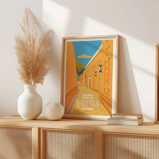 Framed artwork on a wooden shelf with decorative items