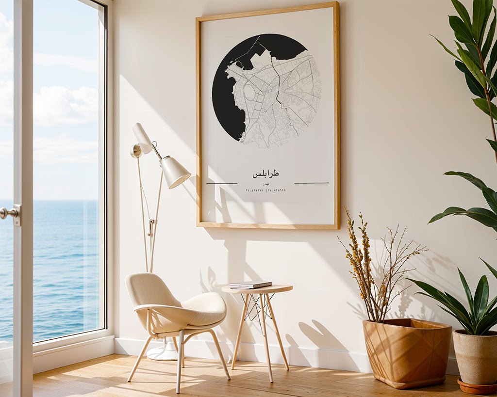 A modern living room features a FN Prints Tripoli City Map on museum-quality fine art paper above a white chair and wooden table. Potted plants flank the floor lamp, while a large window reveals an ocean view, beautifully complemented by the minimalist city map.