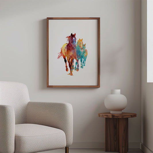 Wild Harmony" by FN Prints, a framed horse wall art featuring two colorful steeds, hangs above a wooden side table with a white decor accent, next to a light upholstered armchair on a pale wall.