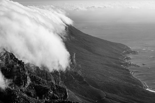 Clouds rolling off the mountain from the top of Table Top mountain in Cape Town, South Africa.