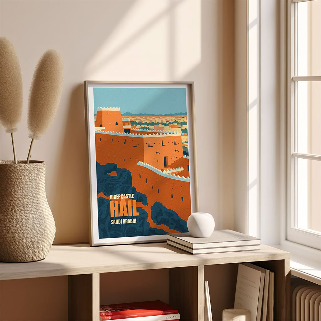 Framed poster of a cityscape on a shelf with books and a vase.
