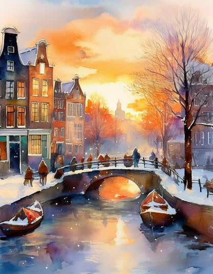 The "Amsterdam Christmastime" digital watercolor artwork by FN Prints beautifully captures a snowy canal in Amsterdam during the holiday season. A stone bridge gracefully arches over the canal, flanked by historic buildings on both sides. Bare trees dot the snowy landscape, while boats float serenely in the water below, reflecting the warm hues of the sky—making it an ideal decor piece for decorating during Christmastime.