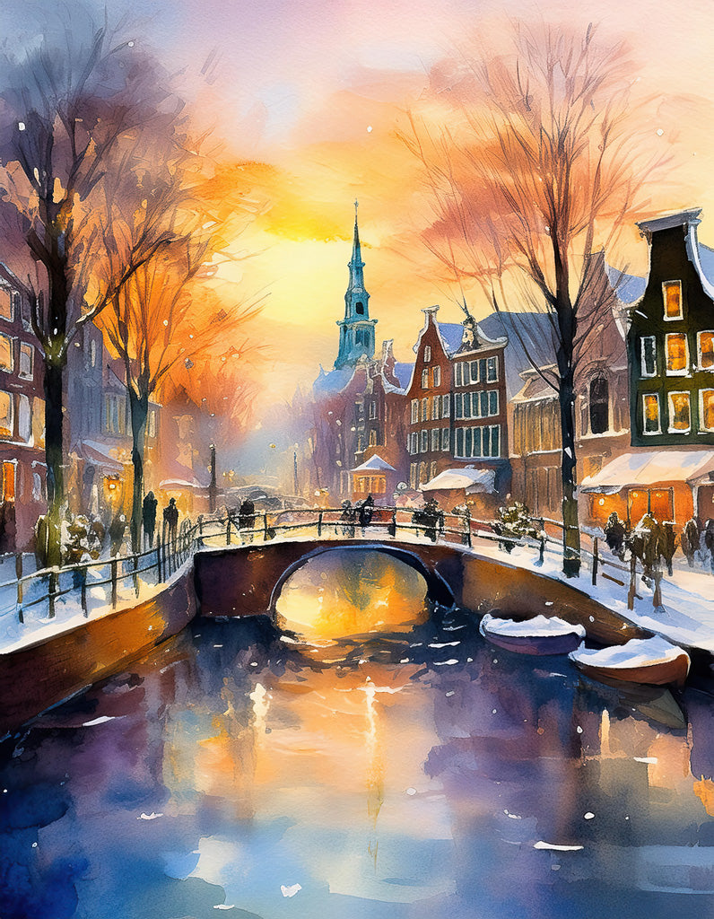 A picturesque winter scene titled "Snowy Amsterdam Canal" by FN Prints. This digital watercolour artwork showcases a canal bordered by snow-covered buildings and trees. People stroll along the bridge and streets, with warm lights glowing from windows. The sky is painted in warm hues of orange and purple—perfect for winter home decor.