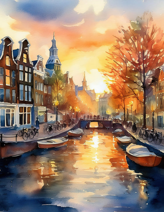 Early Morning In Amsterdam," by FN Prints, depicts a picturesque canal scene just after sunrise. The warm golden and orange hues reflect gently on the water, creating a digital watercolour effect. Traditional buildings line the tranquil canal, with several boats docked along the sides. People stroll along the street and bridge under a sky streaked with colorful clouds.