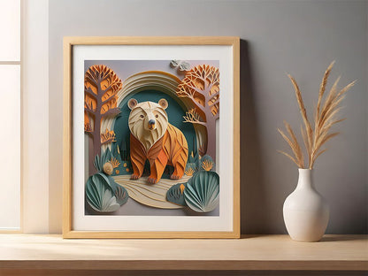 A framed FN Prints children's art print, titled "Blakely The Bear," displays a stylized bear surrounded by abstract trees and foliage in vibrant shades of orange and teal. It sits on a wooden shelf next to a white vase containing tall, dried grasses, enhanced by a striking folded paper effect.