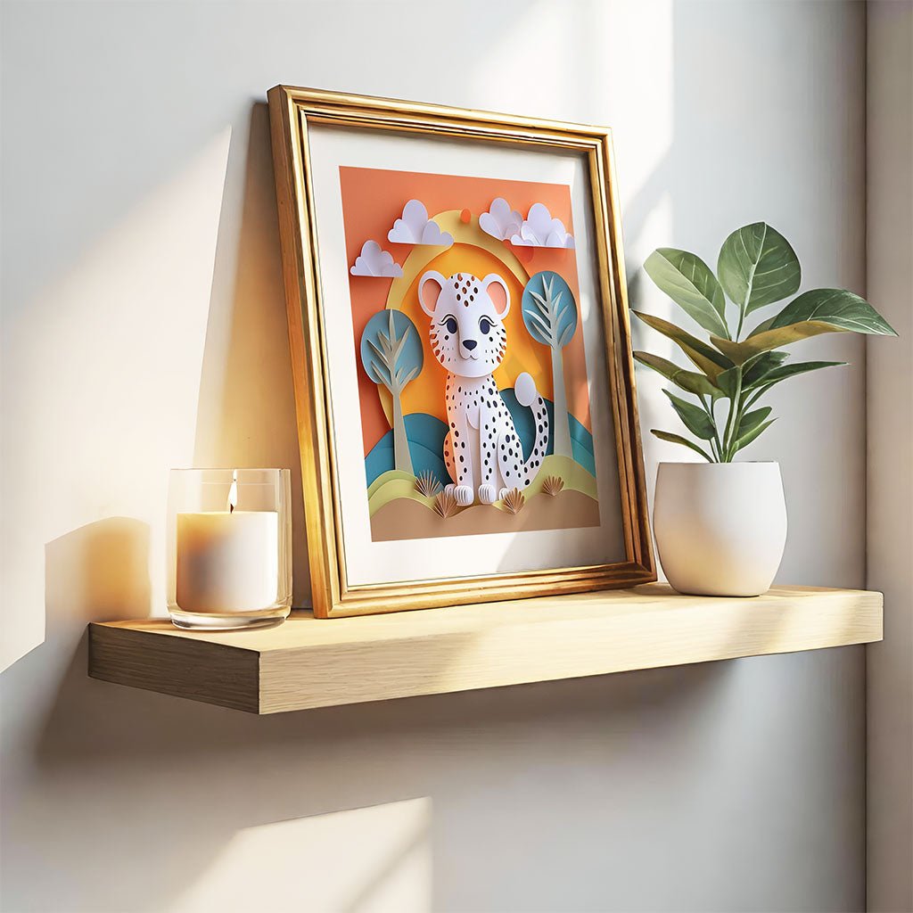 A wooden shelf supports a potted plant and a glowing candle. Leaning against the wall is a framed picture showcasing FN Prints' "Charley The Cheetah Cub," children's digital artwork set in a vibrant savanna. Soft light illuminates from the side.