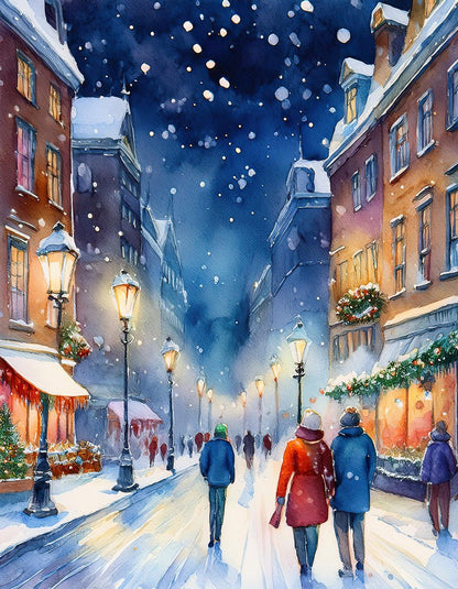 A picturesque snowy evening in a charming town, as depicted in FN Prints' "City Nights: Christmas in London." People walk along a snow-covered street lined with warmly lit old-fashioned street lamps and decorated buildings. Some carry umbrellas, while the windows glow with festive lights and snowflakes gently fall, evoking the enchanting atmosphere of Christmas in London.