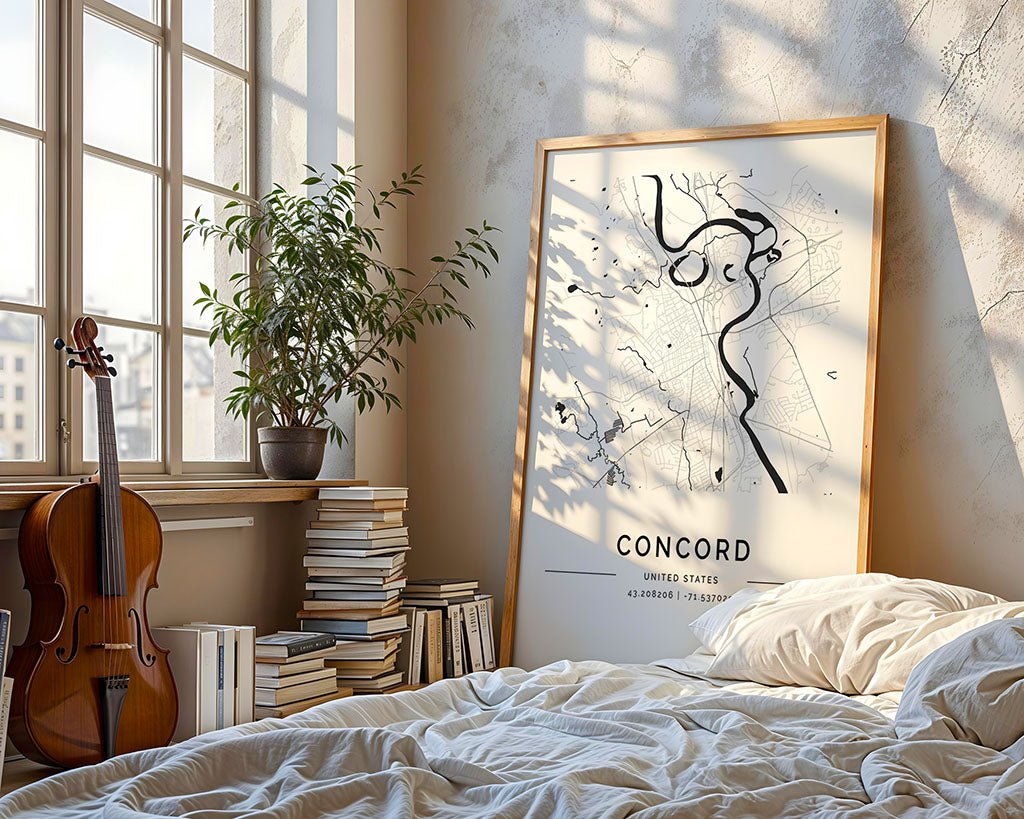 Sunlight floods a cozy room with large windows. A violin sits by books, while an FN Prints Concord City Map leans against the wall. The bed is unmade and a potted plant decorates the windowsill.