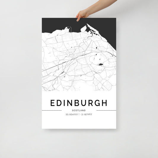 A person holds the FN Prints Edinburgh City Map, a piece of minimalist decor that serves as perfect Edinburgh wall art. This black and white map includes the elegant addition of coordinates 55.953222, -3.197067 printed below.