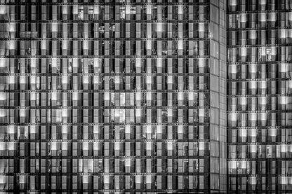 Abstract black and white fine art photography of the Rosewood Hotel facade featuring a dense geometric grid of windows and metallic slats.