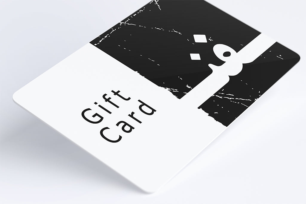 Introducing the FN Prints | Gift Card by FN Prints, showcasing a sleek and minimalist black and white design. The card prominently displays "Gift Card" in black text on a clean white section, complemented by an adjoining black area decorated with a white stripe and abstract digital art-inspired shapes. Crafted from durable plastic, this gift card is presented against a simple background, akin to modern wall art prints.