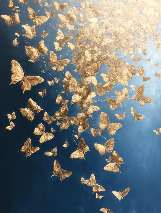 In FN Prints' "Golden Butterflies," a captivating digital artwork, a swarm of golden butterflies flutters against a contrasting dark blue backdrop. The piece appears to be illuminated from above, creating a gradient effect that suggests movement and light reminiscent of expressionist art.