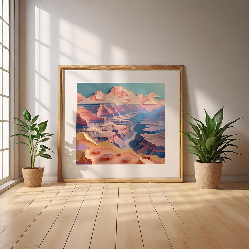 A framed artwork titled "Grand Canyon V" by FN Prints, featuring a colorful abstract landscape in a pastel palette, leans against a wall on a wooden floor. Two potted plants flank the piece as sunlight streams through a large window, casting shadows on the floor.