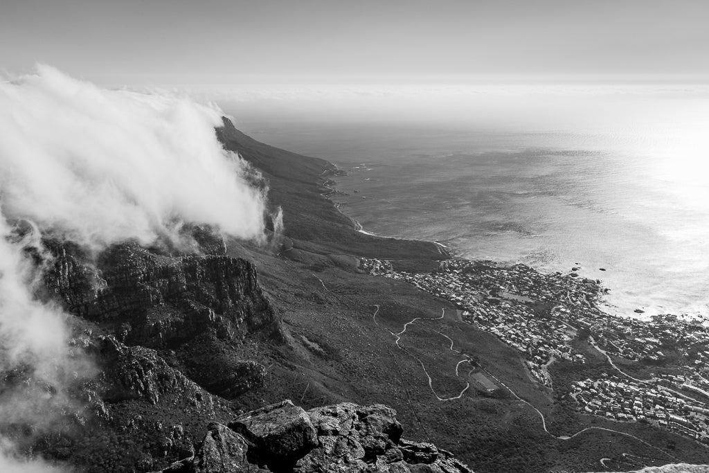 Clouds rolling off Table Top mountain with glimpses of Cape Town City.