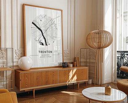 A modern living room features a wooden sideboard with decor, an FN Prints Trenton City Map on the wall, a standing lamp with a spherical shade, and a white round coffee table set on parquet wood flooring.