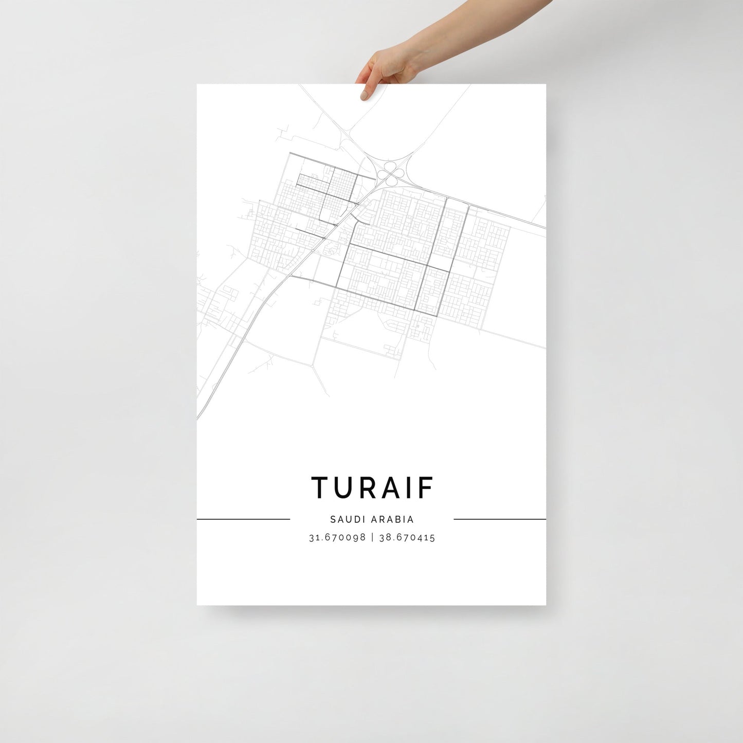 Minimalist black and white street map of Turaif, Saudi Arabia, featuring a detailed grid of city roads and coordinates 31.670098 | 38.670415 at the bottom.