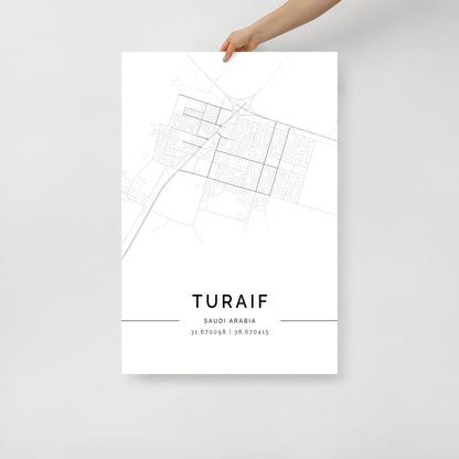 Minimalist black and white street map of Turaif, Saudi Arabia, featuring a detailed grid of city roads and coordinates 31.670098 | 38.670415 at the bottom.