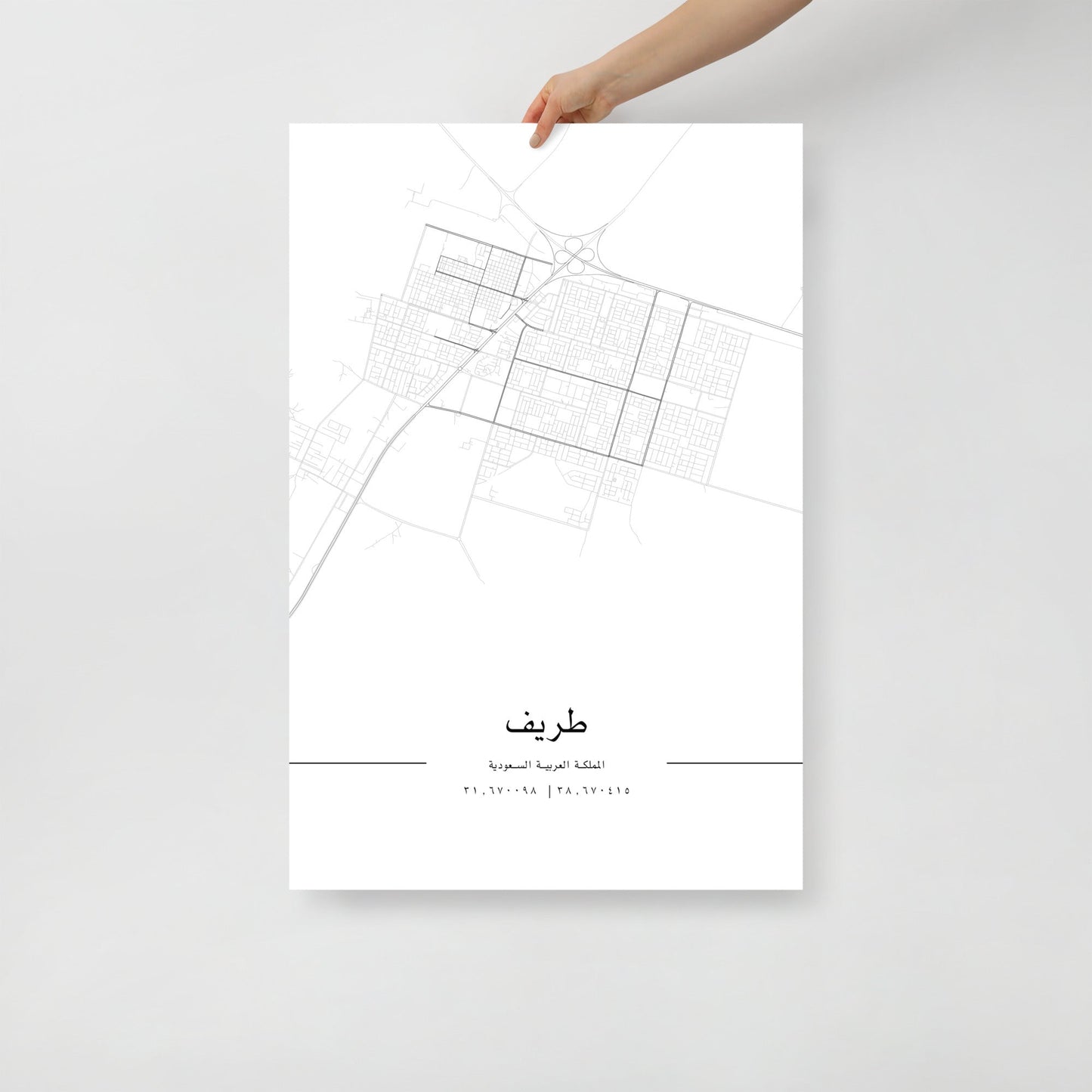 Minimalist black and white street map of Turaif, Saudi Arabia, featuring a detailed grid of city roads and coordinates 31.670098 | 38.670415 at the bottom in arabic.