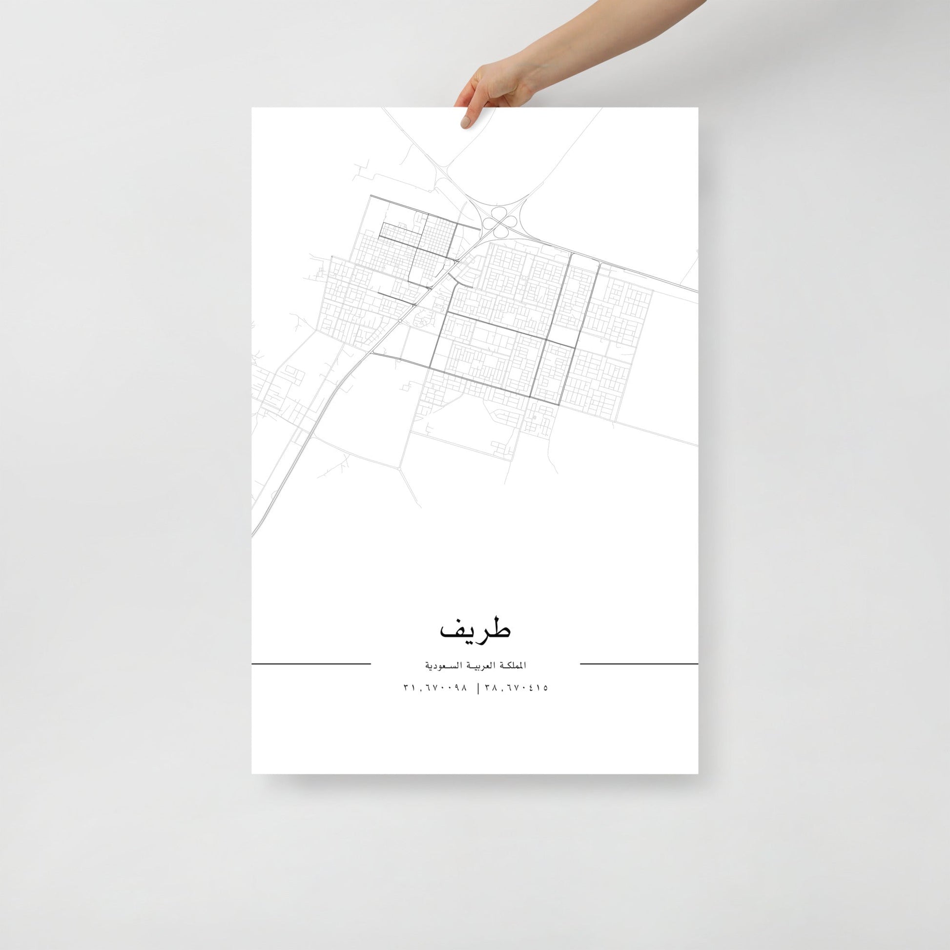 Minimalist black and white street map of Turaif, Saudi Arabia, featuring a detailed grid of city roads and coordinates 31.670098 | 38.670415 at the bottom in arabic.