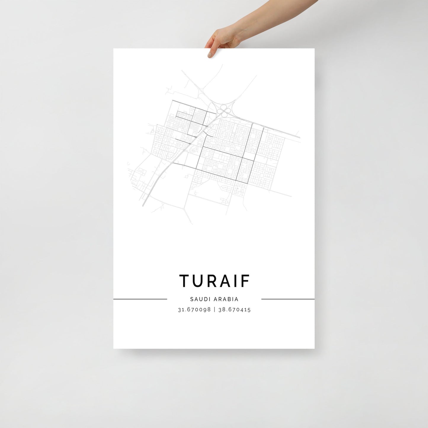 Minimalist black and white street map of Turaif, Saudi Arabia, featuring a detailed grid of city roads and coordinates 31.670098 | 38.670415 at the bottom.