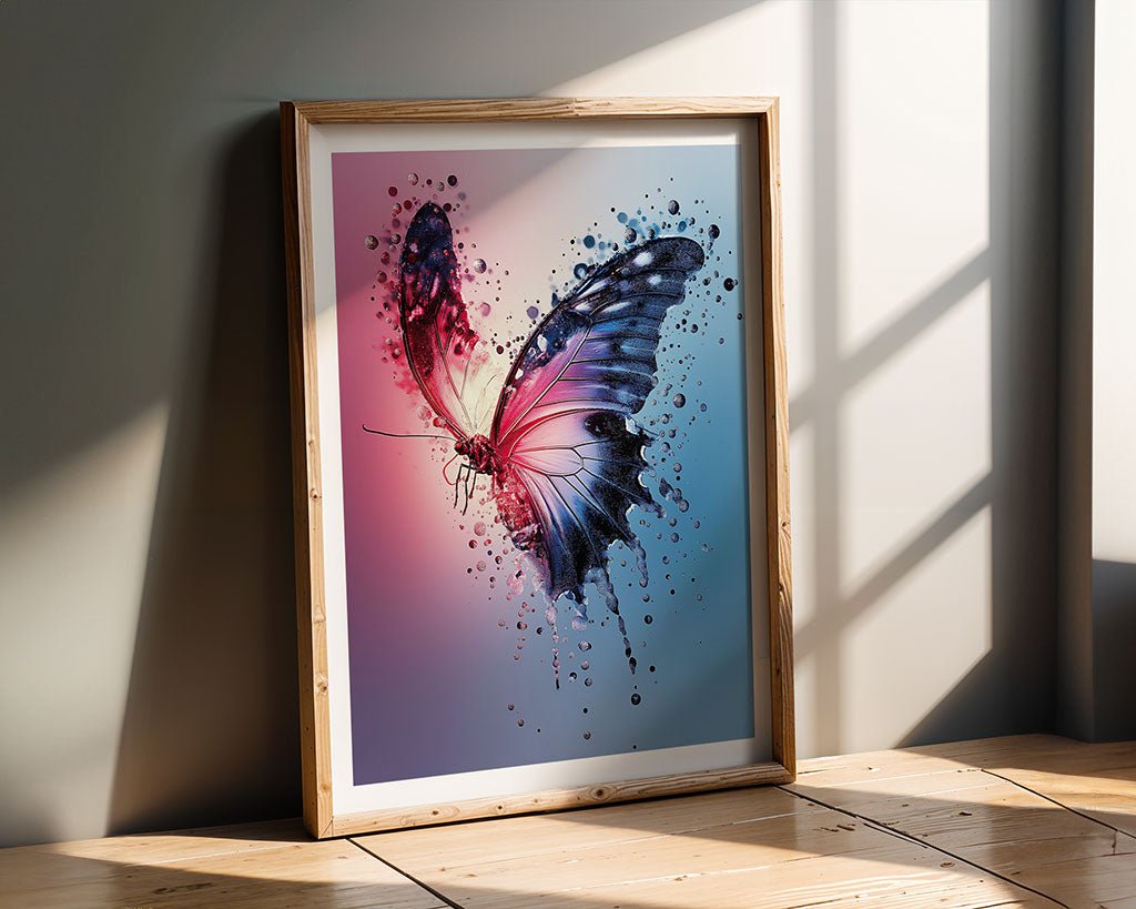 The "Water Drops Butterfly" painting by FN Prints, featuring vibrant splashes of pink, blue, and purple, leans against a wall. Sunlight casts shadows on the wooden floor and wall, enhancing the artwork's surreal beauty.